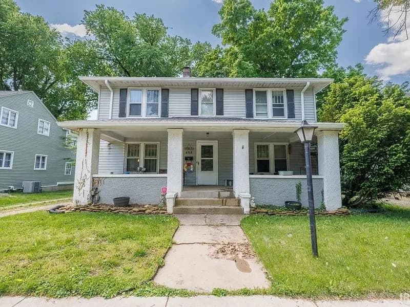 Front exterior of 456 W Hillside Ave in Spencer, Indiana: a classic two-story home with a covered front porch.